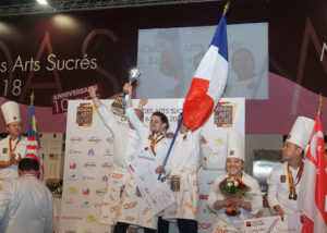 国際製菓コンクール「ル・モンディアル・デ・ザール・シュクレ2022」が10月にフランス・パリで開催される。日本チームは第1回大会より6大会連続で入賞しており、今回の第7回大会も、本コンクールの主催者であるフランスDGFの商品の輸入・販売元である株式会社アルカンのサポートを受け、上位入賞を目指す。